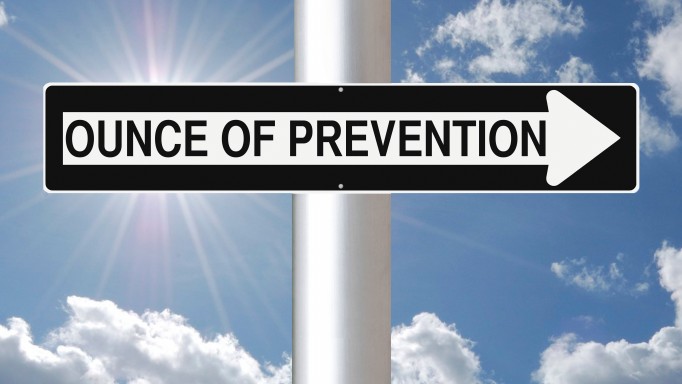 Ounce of Prevention sign against a blue sky