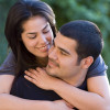 Latin couple playing piggyback and smiling