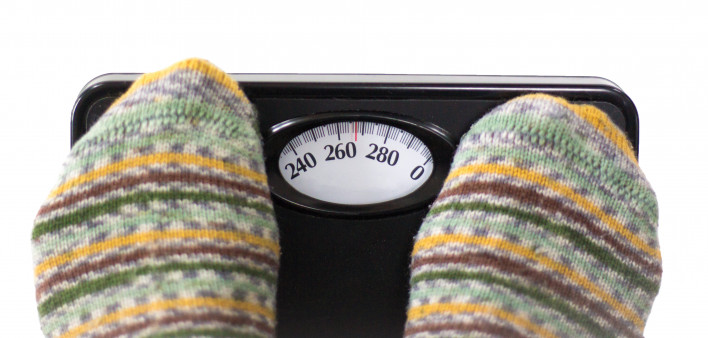 socked feet on scale