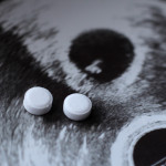 Ultrasound of a pregnant woman and pills medication