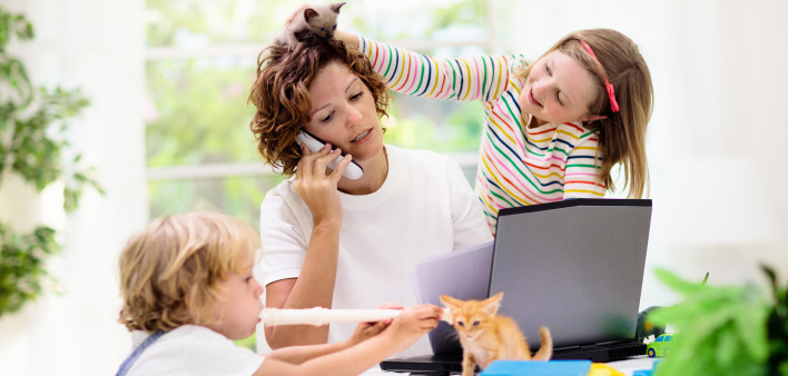 Mother working from home with kids.