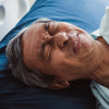Old senior asian patient suffering from back pain, back ache