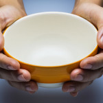 hands holding empty bowl