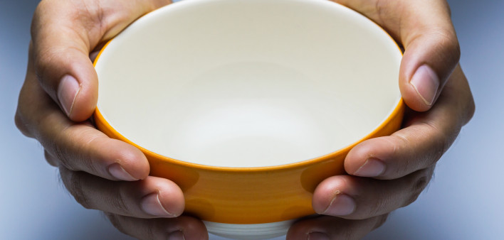 hands holding empty bowl