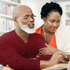 Shot of a happy mature couple using a laptop together at home