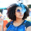 African American woman smoking in cafeteria