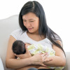 Asain mother breatfeeding baby