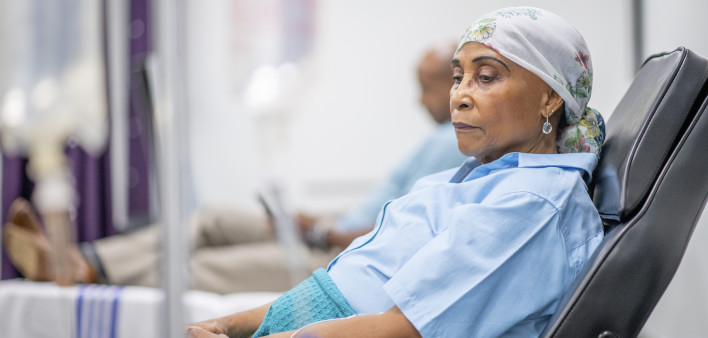 Senior adult woman in the oncology unit receiving chemotherapy treatment.