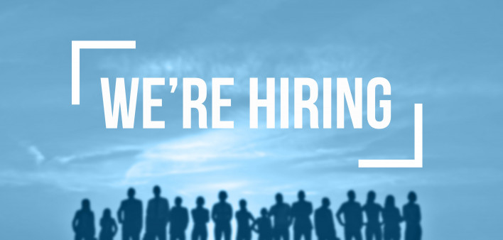 we're hiring in front of shilhouette of group of people