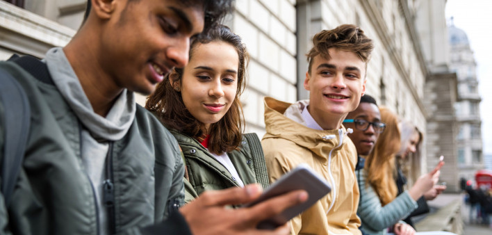 Teenagers students using smartphone on a school break