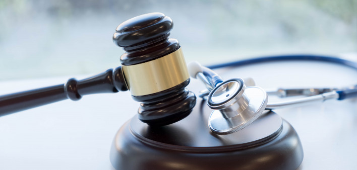 Gavel and stethoscope. medical jurisprudence. legal definition of medical malpractice. attorney. common errors doctors, nurses and hospitals make