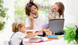 Mother working from home with kids.