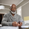 Smart apps make for smart budgeting senior black man with phone