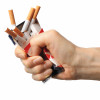 Hand crushing box of cigarettes