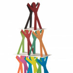 cut out figures stacked like a house of cards