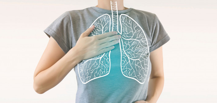 woman holding chest diagram of lungs