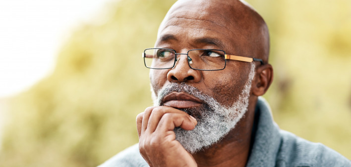 senior man outdoors thinking