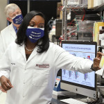 President Joe Biden speaks with Kizzmekia Corbett, PhD, the lead COVID-19 vaccine scientist, during his visit to the U.S. National Institutes of Health.