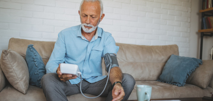 Senior man measuring his blood pressure