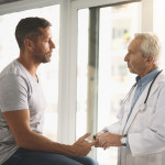 Cropped shot of a senior doctor giving his male patient a thorough checkup during his consultation