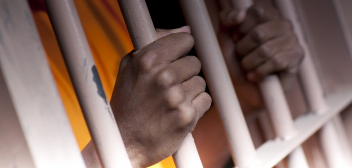 Prison Prisoner Prison Reform hands on bars