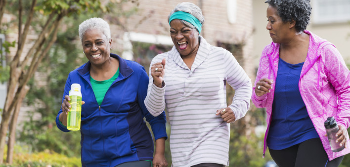Three senior black women exercising together