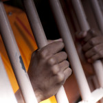 Prison Prisoner Prison Reform hands on bars