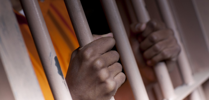 Prison Prisoner Prison Reform hands on bars