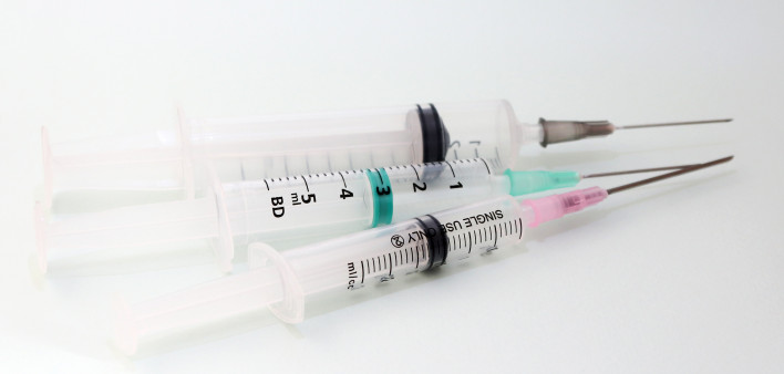 Three disposable medical syringes