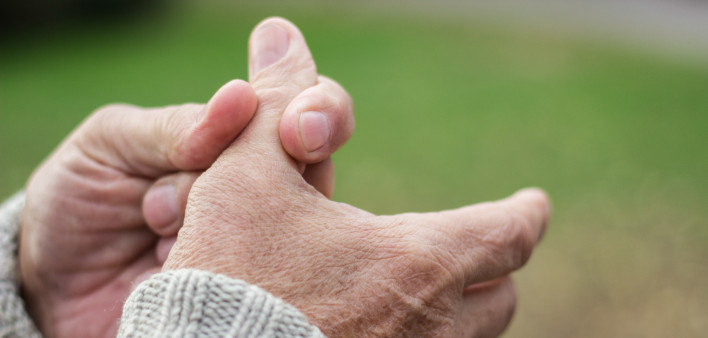 Elderly man has pain in fingers and hands. Old man with finger pain