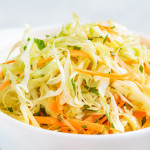 Fresh coleslaw salad in white bowl