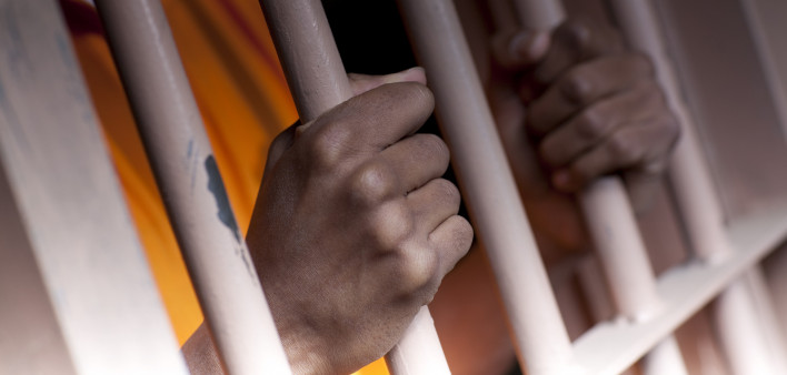 Prison Prisoner Prison Reform hands on bars