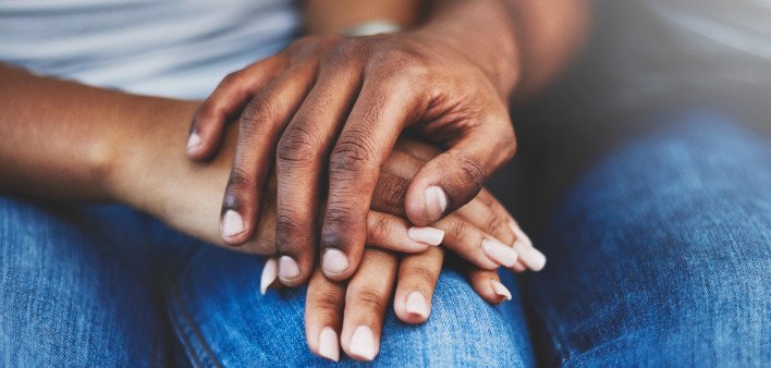 ethnic black latino man and woman holding hands