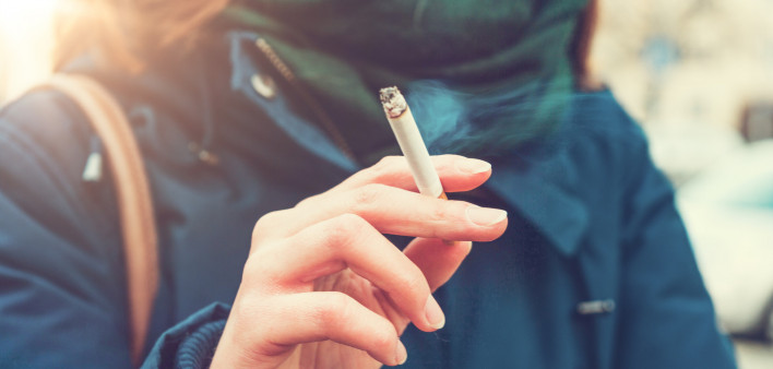 Young woman enjoying a cigarette