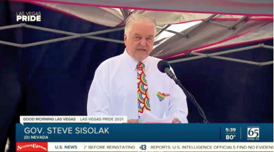 Nevada Governor Steve Sisolak signs HIV- and LGBTQ-related bills during a Pride celebration in Las Vegas