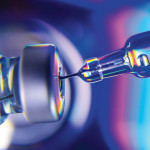 needle going into vial vaccine