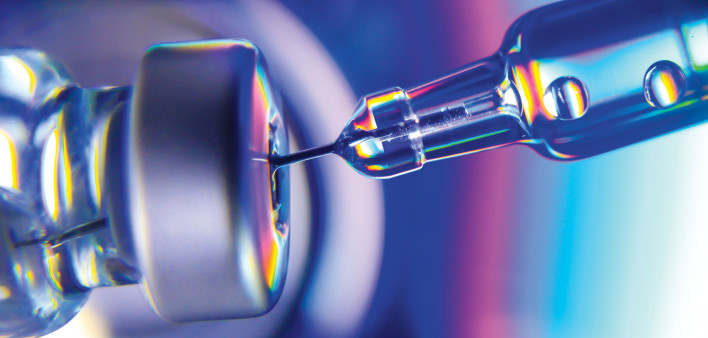 needle going into vial vaccine