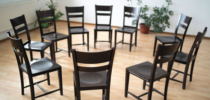 chairs arranged in a circle support group aa meeting