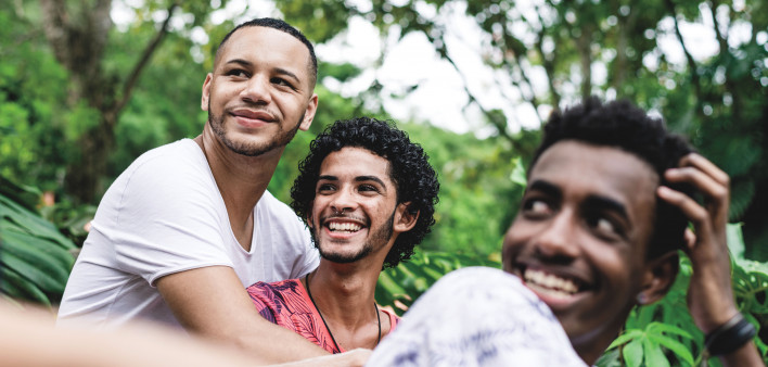 Gay friends having a good time at public park