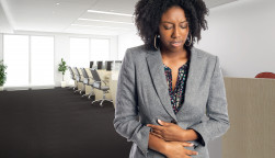 woman girl stomach cramps office