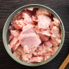 Canned soy free albacore white meat tuna packed in water on wood table background