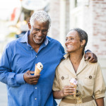 A senior african american couple enjoy an evening on the town with ice cream
