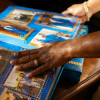 Rafiah Maxie pages through a scrapbook she and her son Jamal made together.