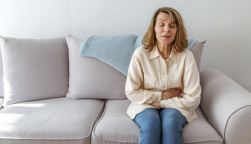 Senior woman suffering from stomach ache s