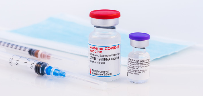 Pfizer BioNTech and Moderna Covid-19 vaccine on a white background.