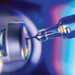 needle going into vial vaccine