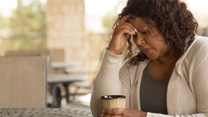 African American middle age woman looking sad.