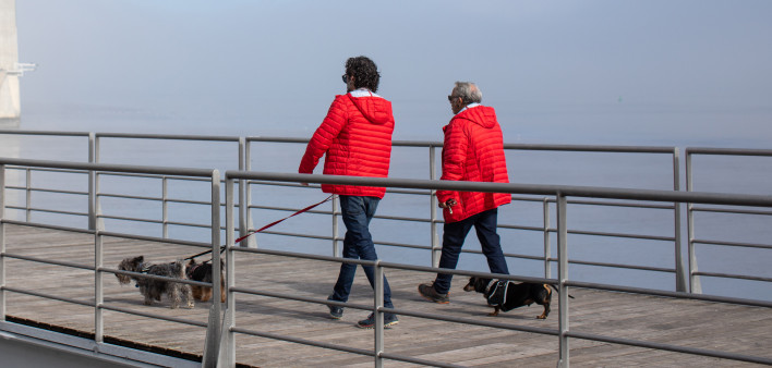 Portugal man living with HIV with a taller man walking