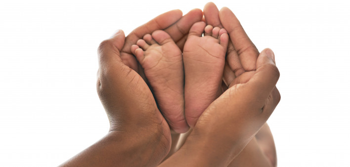 Hands and baby feet