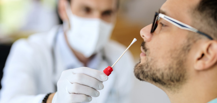 Close-up of young man getting PCR test at doctor's office during coronavirus epidemic. (56 kB)